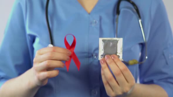 Doctor Warning People About Sexually Transmitted Diseases, AIDS Awareness Ribbon