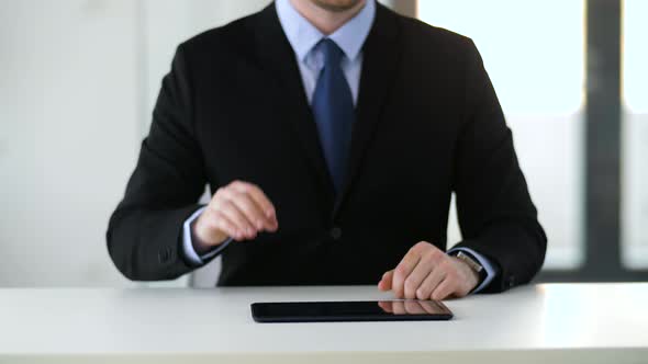 Businessman Working with Tablet Pc 4