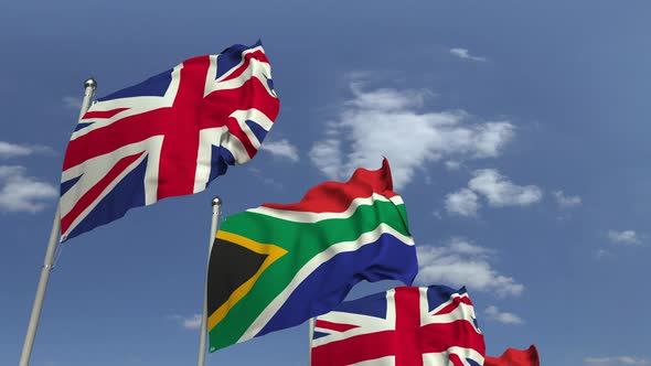 Row of Waving Flags of South Africa and the United Kingdom