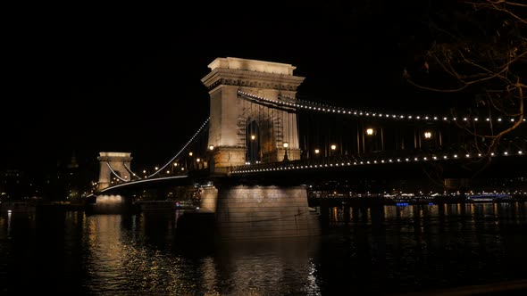 Szechenyi Bridge in Budapest over river Danube by night 4K 2160p UltraHD footage - Famous Chain Brid