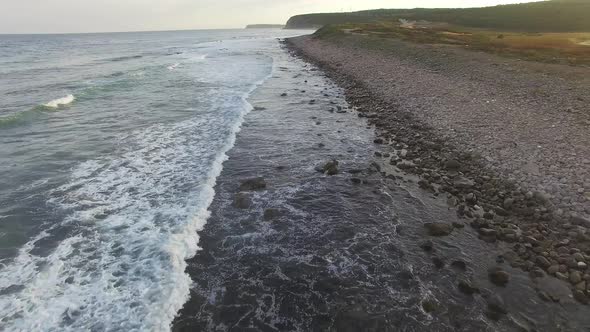 Drone View of the Sea Coast with Rocky Shore and Waves