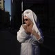 Girl in Bathrobe and Towel on Head in a City Street - VideoHive Item for Sale