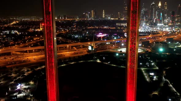 Aerial hyperlapse of the illuminated Dubai Frame at night, U.A.E.