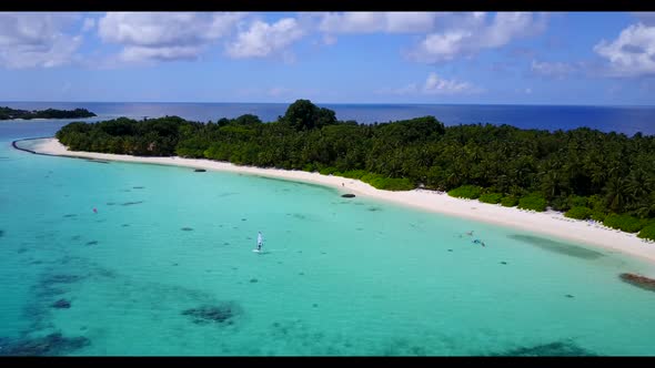 Aerial top down nature of marine resort beach break by blue green sea and clean sand background of a