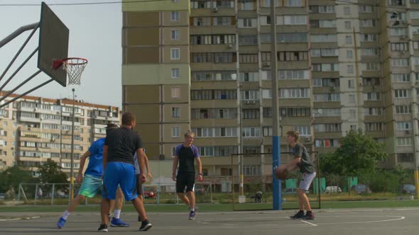 Streetball Player Taking a Shot During Basketball Game