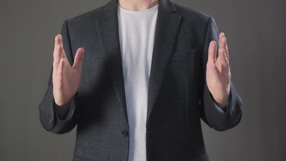 Businessman Holding Empty Space with Both Hands