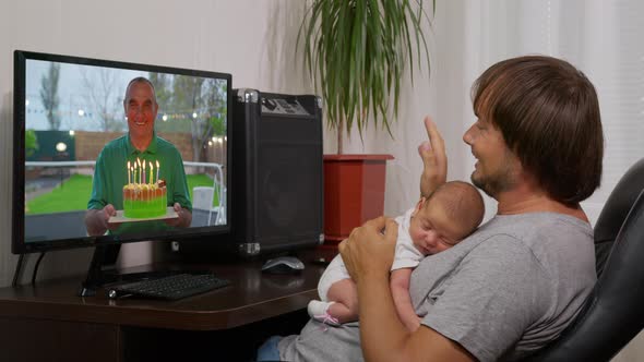 Father Congratulating a Man on Her Birthday Using a Video Call. Home Quarantine, Social Distancing