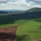 Aerial video of farm fields and mountain with clouds - VideoHive Item for Sale