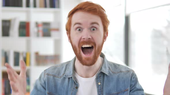 Casual Redhead Man Celebrating Success