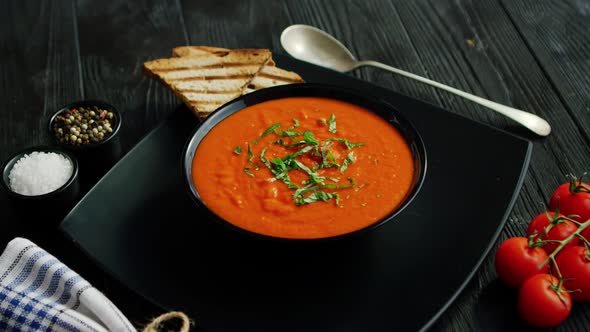 Tomato Soup in Bowl with Crisp Bread