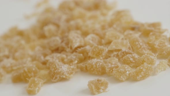 Crystallized Zingiber officinale cubes slow pan 4K 2160p 30fps UltraHD footage - Cooked and candied 