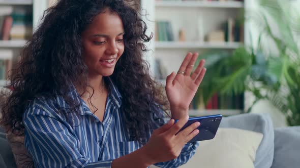 Smiling Young Indian Woman Look at Cellphone Screen Talk on Video Call Online