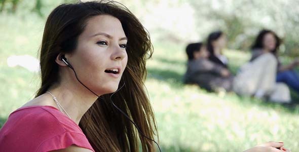 Young Woman Singing In Park1