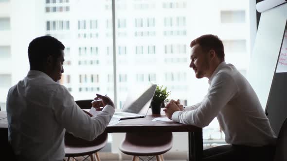 African American Business Man Studying Paper Document and Signing Contract Background of Window.