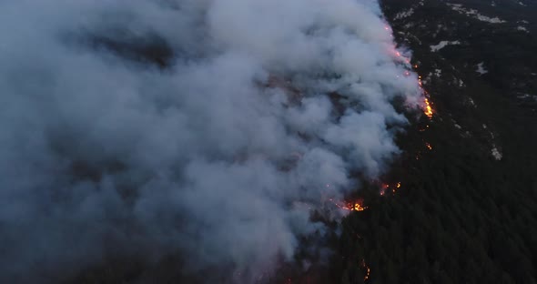 Aerial Panoramic View of a Forest Fire at Night Heavy Smoke Causes Air Pollution and Fire in Full