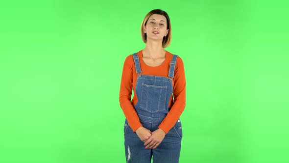 Beautiful Girl Is Reporting and Tells a Lot of Interesting Informations. Green Screen