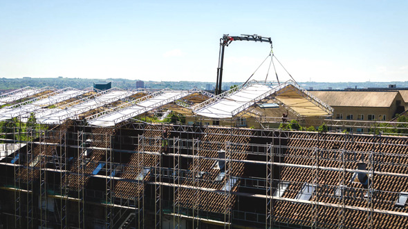 Construction Workers Setting Up Scaffolds