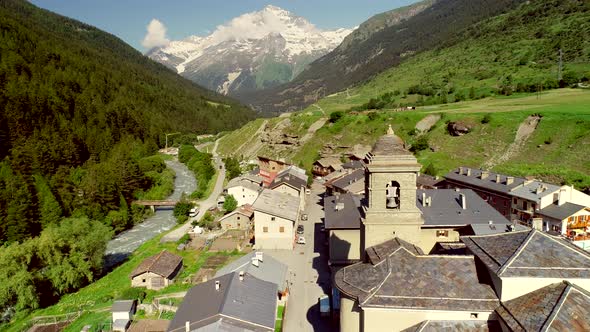 Aerial view of Lanslebourg village and snow peak mountain, Savoie, France.