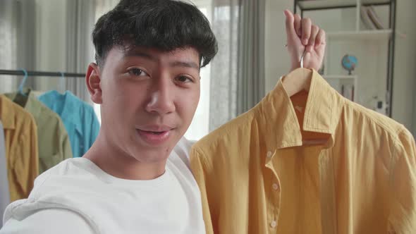 Close Up Of Asian Man Online Seller Recommending A Shirt And Recording Video While Selling Clothes