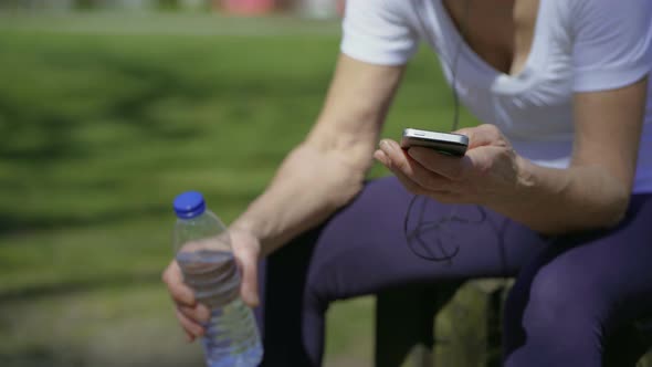 Senior Sportswoman Using Smartphone