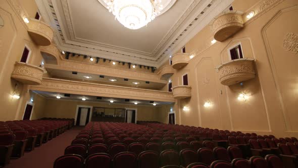 Auditorium of Old Theater with Armchairs and Balconies