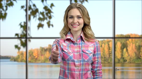 Young Happy Woman Giving Thumb Up to Camera