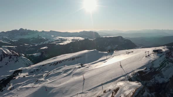 Dolly forward drone shot over high alpine ski slope