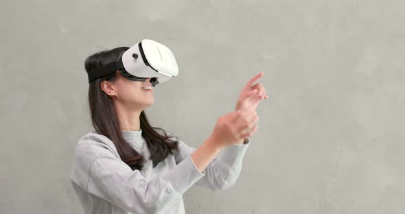 Woman playing game with VR device