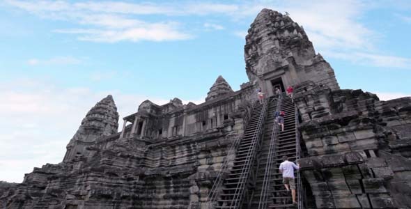 Tourists Climbing Angkor Wat
