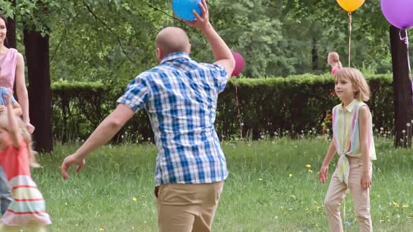 Joyous Kids and Parents Playing Together