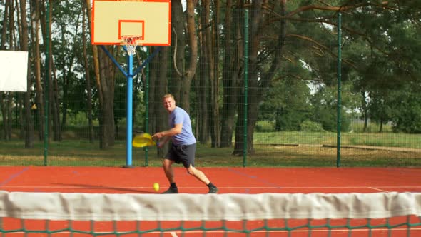 Male Tennis Player Playing Match on Hardcourt