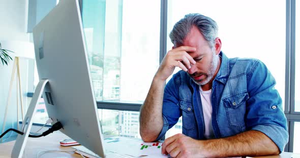 Worried male executive shaking his head