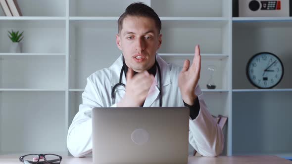 Doctor Talking to Patient Making Video Call on Laptop