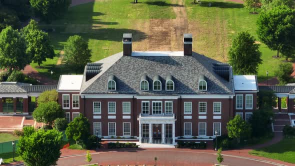 Historic building on campus of Johns Hopkins University campus. Aerial tilt up reveal of prestigious