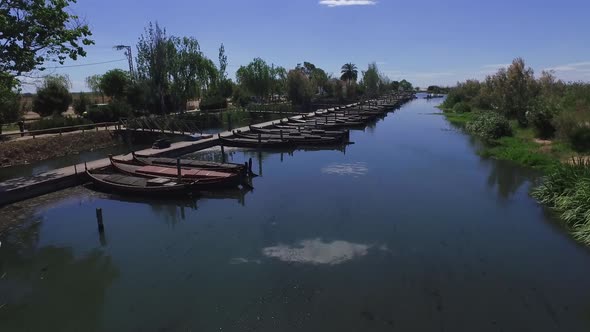 Sailing Through the Canal with The Boats Moored