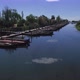 Sailing Through the Canal with The Boats Moored - VideoHive Item for Sale