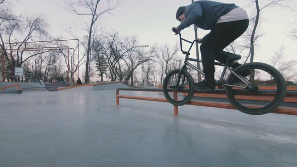 Bmx Rider Doing Tricks in Concrete Skatepark Slow Motion