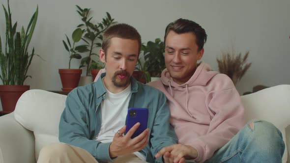 Two Young Lgbt Men are Talking with Their Friends on the Video Call Listening Attentively and