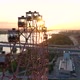 Drone View Colorful Ferris Wheel in Amusement Park on River and City Landscape - VideoHive Item for Sale