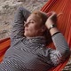 Mature Blond Woman Lying in Hammock at Beach - VideoHive Item for Sale
