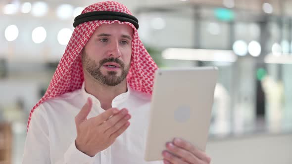 Arab Businessman Doing Video Chat on Tablet 