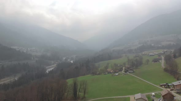 Drone flying over a foggy French Valley