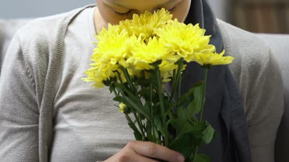 Happy Cancer Survivor Smelling Flowers, Feels Better After Chemotherapy, Hope