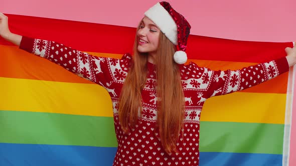 Girl in Christmas Sweater Posing with Rainbow Flag Celebrate Parade Tolerance Same Sex Marriages