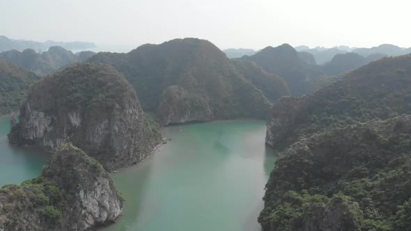 Aerial: unique flying over Ha Long Bay, famous tourism destination in Vietnam