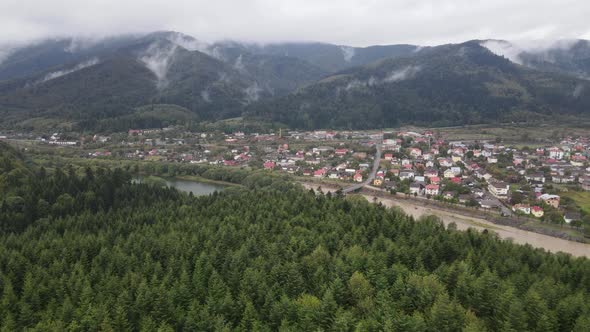 Village in the Carpathian Mountains in Autumn. Slow Motion, Aerial View