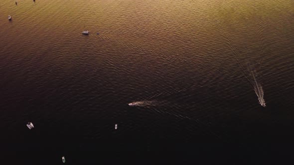 Beautiful tropical ocean full of boats during sunset.