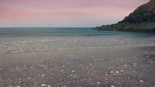 Gliding Over Beach Shore At Sunset