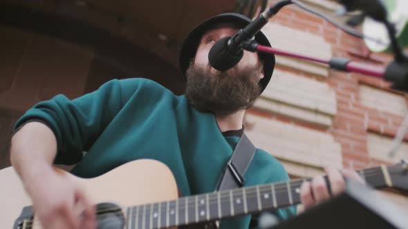 Man Performing Song Outside