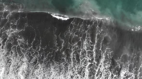 Top Down Aerial View of Giant Ocean Waves Crashing and Foaming